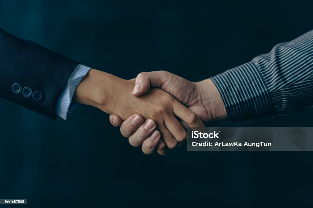 handshake greeting or business cooperation, business deal concept